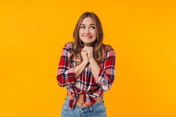 Fototapeta premium Image of happy young attractive woman praying or making wish