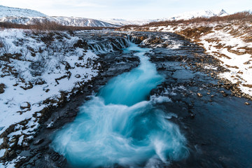 Bruarfoss Waterfall in winter. Beautiful landscape of breathtaking Iceland that is worth it to visit all year long. Tourism in Iceland has its boom because of the unforgettable gorgeous scenery