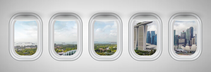 Airplane windows with Singapore skyline view. Travel and holiday abstract concept