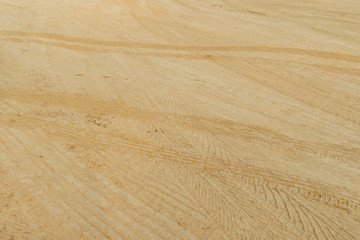 Vehicle tracks on the road for background of construction or transportation.