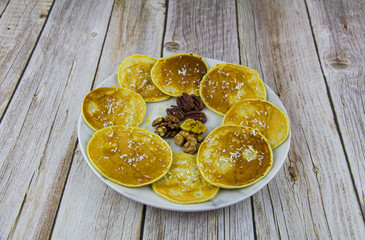 Pancakes with nuts and oatmeal milk and honey