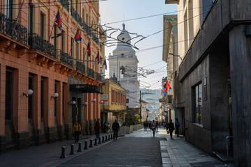 Obraz premium QUITO, ECUADOR - FEBRUARY 07, 2020: The main pedestrian street at historic colonial downtown of Quito, Ecuador. South America.
