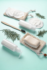 Obraz na płótnie Canvas Zero waste, sustainable bathroom and lifestyle. Bamboo toothbrush, natural soap, cotton make-up removal pads, homemade DIY beauty products in reusable bottles
