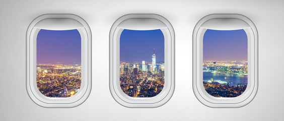 Manhattan night skyline as seen from airplane windows, New York City. Business, travel and holiday concept abstract