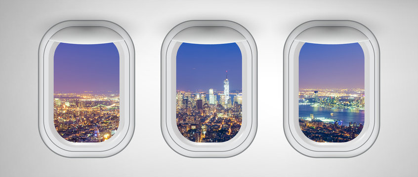 Fototapeta Manhattan night skyline as seen from airplane windows, New York City. Business, travel and holiday concept abstract