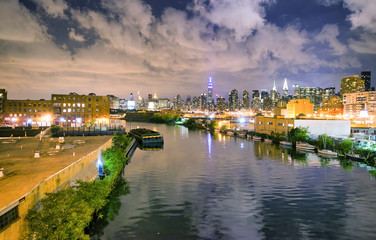 East River and Manhattan skyline on a beautiful summer night, New York City