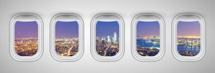 Airplane windows with New York City night view. Travel and holiday abstract concept