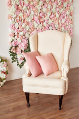 Summer blossoming delicate roses and hydrangeas on flowers festive background, pastel and soft bouquet floral card. Spring Greeting Card Template. Copy Space. Armchair on colored background