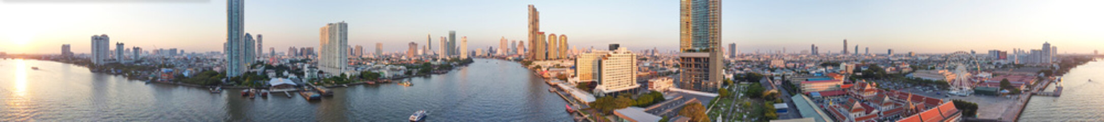 Fototapeta premium Bangkok, Thailand. Aerial view of cityscape and Chao Phraya River ar sunset