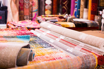 Fototapeta premium Image of colorful wool carpets for sale at showroom