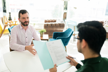 Applicant Talking To Recruiter At Office