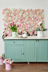 Summer blossoming delicate roses and hydrangeas on flowers festive background, pastel and soft bouquet floral card. Spring Greeting Card Template. Copy Space. Kitchen on colored background