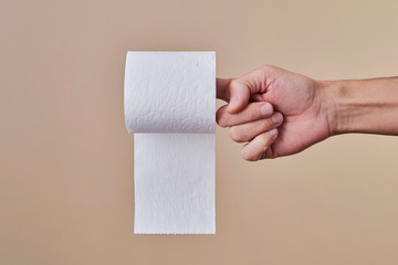 man with a toilet paper roll in his hand