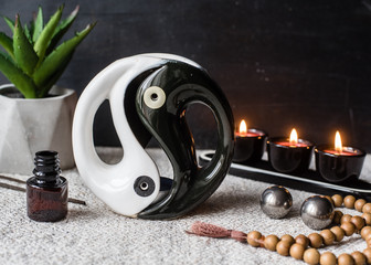 aromatherapy concept. Aroma lamp with yin yang symbol, candles, aroma sticks, rosary, aromatic oils...