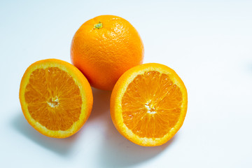 Fresh orange cut fruit on white background