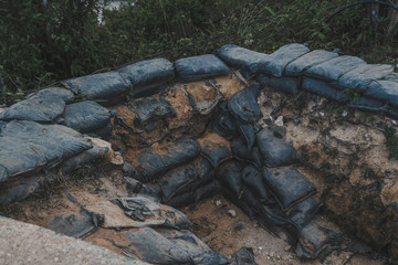 Sandbag for protecting the enemy from invading front line. Military bunker base in battlefield. Military controlled area