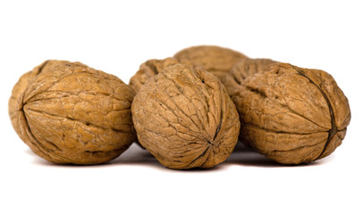 Delicious whole walnuts isolated on a white background