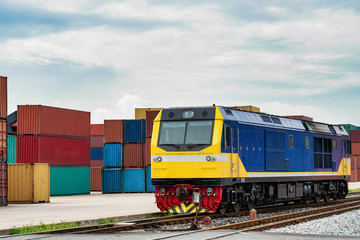 Obraz premium crane lifting container box to container truck a logistics transports in shipyard, a supply chain technology and logistics concept