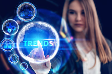 Business, Technology, Internet and network concept. Young businessman working on a virtual screen of the future and sees the inscription: Trends