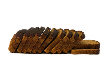 Sliced rye bread on a white background. Delicious, brown bread.