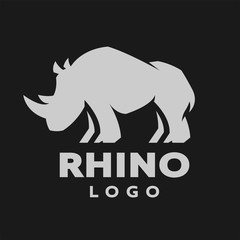 African rhino silhouette. Logo, symbol on a dark background. Vector illustration. © makstrv