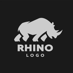 African rhino silhouette. Logo, symbol on a dark background. Vector illustration.