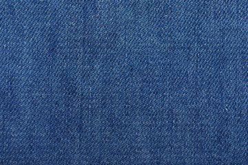 Naklejka premium Texture of blue jeans as background, closeup