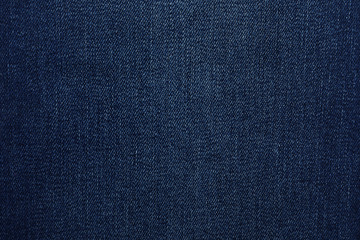 Fototapeta na wymiar Texture of dark blue jeans as background, closeup