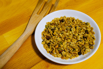 Cereal breakfast with Whole Grain Oats and Dried Strawberry. Tasty and perfect for breakfast, a healthy snack, workout meal or as ice cream toppings. Top view, flat lay.