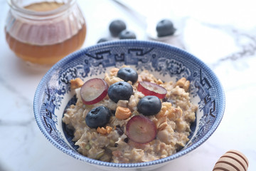 top view of blue berry on oats on table 