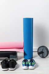 step platform, fitness mats and sport equipment on floor at home