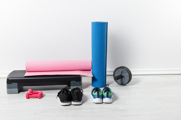 fitness mats and sports stuff on floor at home