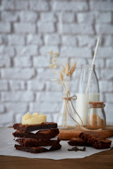 Brownie stack with cream on table with copy space