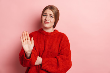 Photo of displeased blonde woman making stop gesture at camera