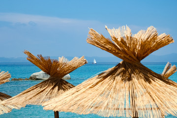 beautiful umbrellas sun loungers by the sea on nature background