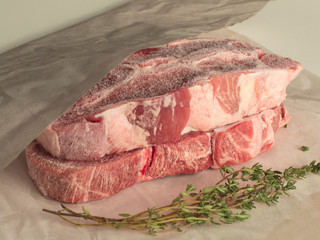 frozen meat wrapped in white paper. 