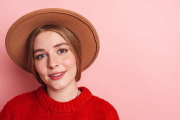 Photo of happy beautiful woman in hat smiling and looking at camera