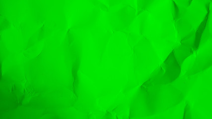 green paper abstract background. crumpled green cardboard texture