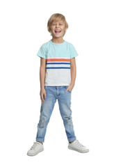 Happy little boy in casual outfit on white background