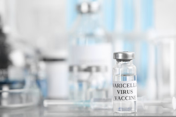 Chickenpox vaccine on table in laboratory, space for text. Varicella virus prevention