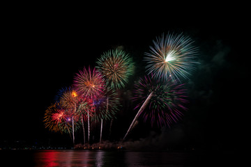 Colorful fireworks of various colors at night with celebration and anniversary concept