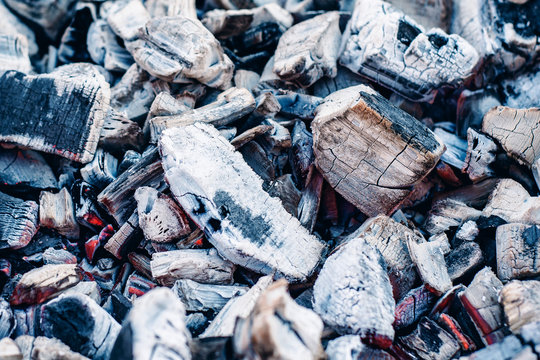 Background image of coals with ash.