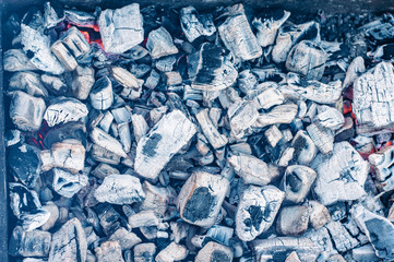 Background image of coals with ash.