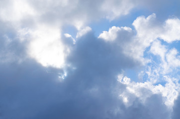 Obraz premium Blue sky with white and dark clouds