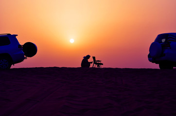 Dune sunset bedouin car. Nature background. Outdoor tourism landscape. Extreme vacation.