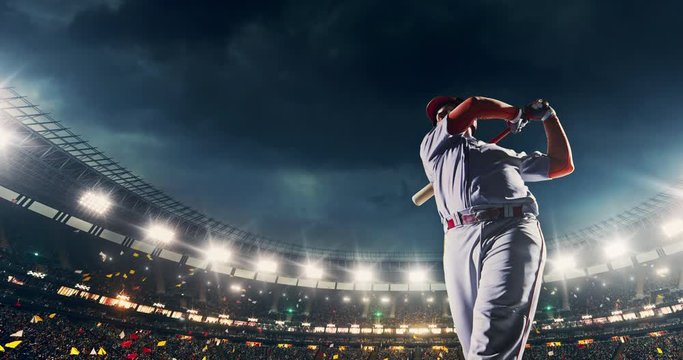 Baseball male player in action during the game on a professional baseball stadium with splashes and flames animation. He wears unbranded sport clothes. The stadium is made in 3D.