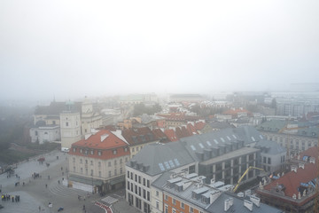 Aerial view of the Warsaw Historic Center in fog.