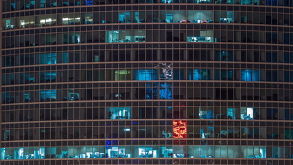 Close up view to office windows in Skyscrapers Moscow-City at night timelapse from top, Moscow, Russia 4K