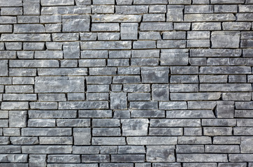 gray brick wall with rough texture