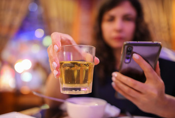 Girl drinks beer from a glass